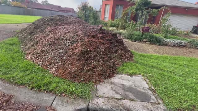 Front-lawn mulch deliveries on a residential property