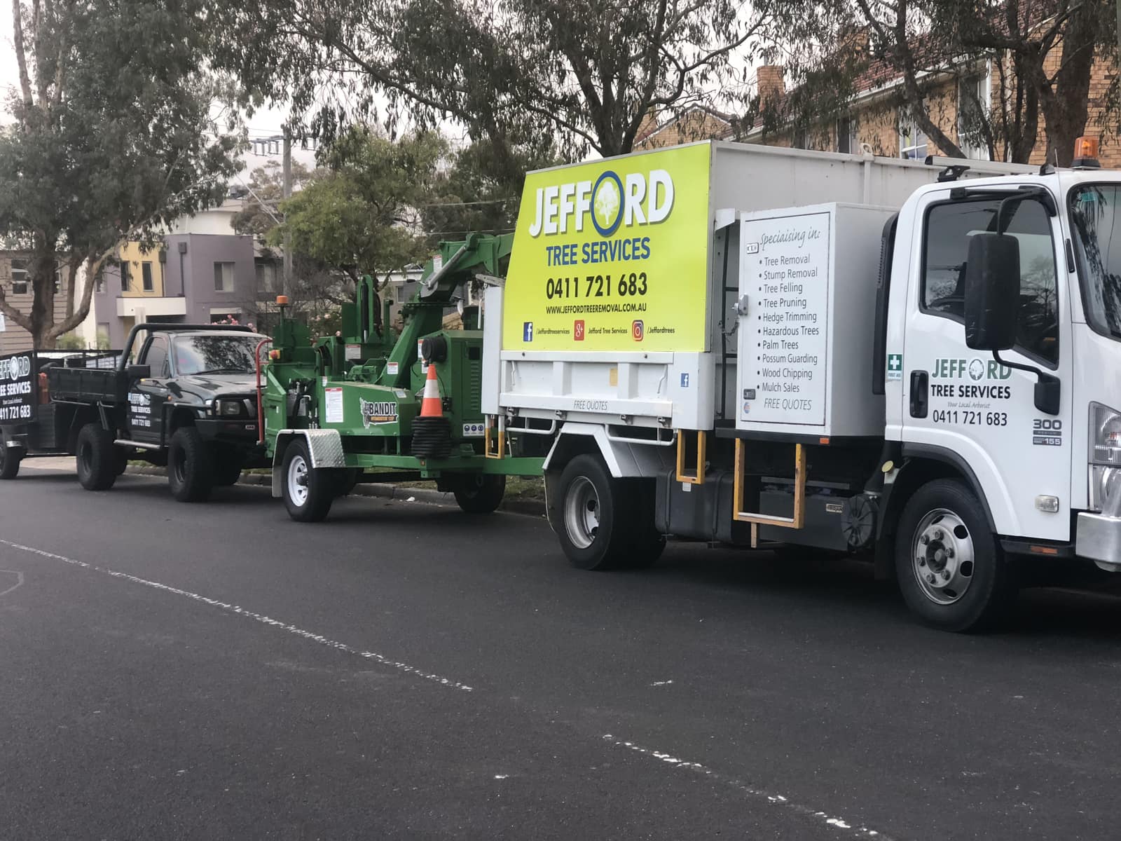 Jefford Tree Services fleet including chipper truck, Bandit wood chipper and ute
